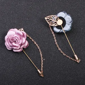 Fabric flower brooch with tassel chain and metal leaf, elegant camellia long pin for women.