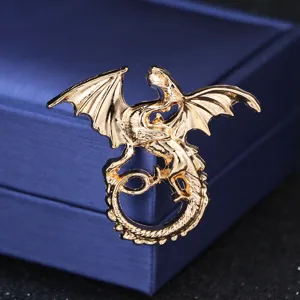 Golden dragon brooch detail, vintage metal flying dragon pin for scarves and shawls.