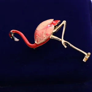 Exquisite alloy flamingo brooch with red enamel and gold trim, perfect clothing accessory.