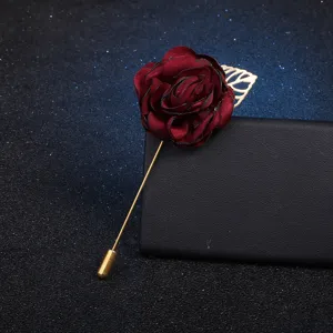 Fabric flower brooch with gold leaf, elegant textile rose pin for women's stylish apparel.
