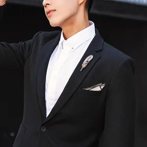 Elegant feather brooch for men suit and coat, stylish Korean fashion lapel pin accessory.
