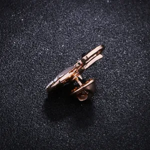 Detailed view of elegant rose gold swan brooch with sparkling crystals and secure pin back.