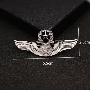 Silver metal flying eagle brooch with five-pointed star and detailed wings badge