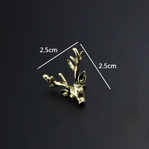 Vintage brass deer head brooch pin for men, retro collar lapel pin accessory detail.