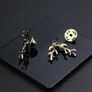 Vintage deer antler lapel pin collar pin detail view, bronze metal retro brooch accessory.
