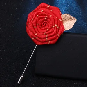 Handmade red ribbon rose brooch with gold leaf and long pin, exquisite clothing accessory.