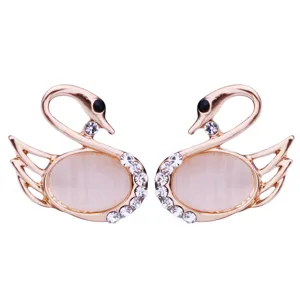 Elegant rose gold swan brooch with cat's eye stone and crystal rhinestones for women fashion.