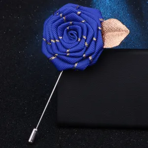 Exquisite blue ribbon rose brooch featuring a delicate gold leaf detail. Perfect for clothing accessory.