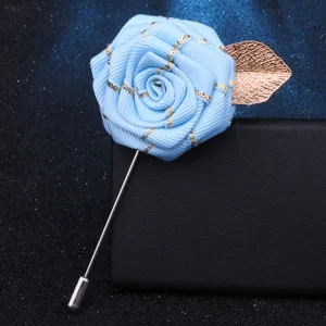 Handmade light blue ribbon rose brooch with gold leaf, elegant lapel pin accessory.