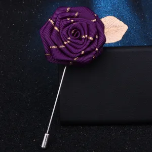 Handmade purple ribbon rose brooch with gold leaf, elegant clothing accessory for men and women.