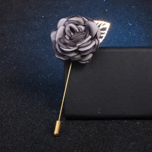 Grey fabric flower brooch detailed view, elegant brooch pin with leaf accessory for women.
