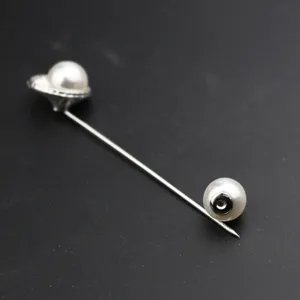 Detailed close-up of Korean style men pearl lapel pin brooch, vintage silver long needle.