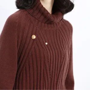 Exquisite pearl brooch set for women and men, elegant vintage shell pin detail on sweater.