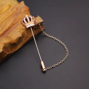Rose gold crown lapel pin with chain detail, elegant men suit brooch accessory for daily wear.