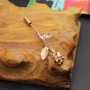 Rose flower metal lapel pin brooch, exquisite rose gold tone fashion jewelry detail.