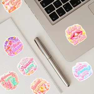 Close-up of cute pastel sweet candy style waterproof stickers displayed nicely on a clean desk.