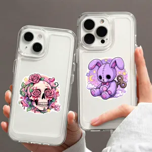 Transparante telefoonhoesjes versierd met creatieve pastelgoth schedel en konijn vinyl stickers.