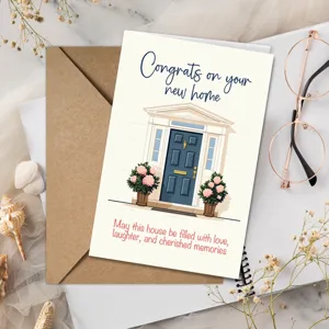 Housewarming greeting card featuring house illustration, blue door, and matching paper envelope.