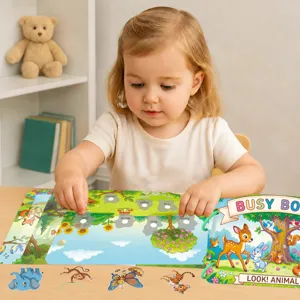 Toddler playing with early educational animal cognitive busy book interactive sticker toy.