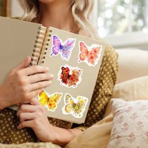 Watercolor butterfly stickers detailed view showing vibrant floral designs on a notebook for daily decor.