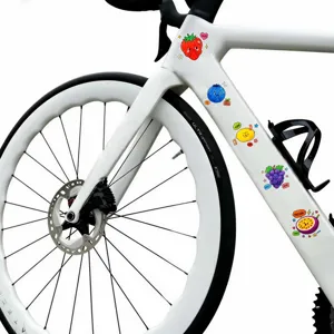 Close-up detail of waterproof PET transparent cartoon fruit stickers applied on bike frame.