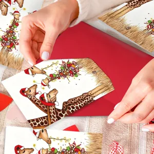 Set di biglietti d'auguri natalizi con simpatica giraffa e busta rossa per le feste.