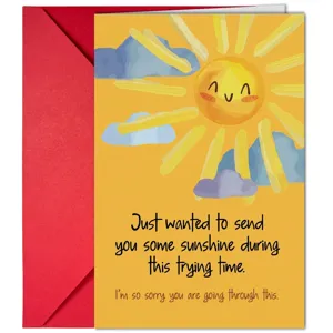 Detailed view of yellow greeting card with cute sun illustration and red envelope for warm wishes.