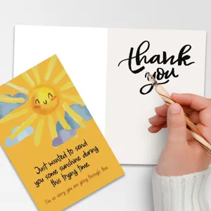 Greeting card detail showing cute sunshine illustration and handwritten thank you message.