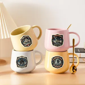 Detailed shot of ceramic coffee mugs featuring vintage nautical sailing ship designs.
