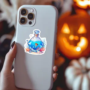 Close-up detail of a magical potion bottle sticker featuring a cute mermaid and sea elements.