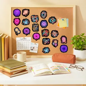 Colorful neon fireworks stickers detail view, vibrant waterproof decal for luggage laptop.
