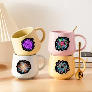 Detailed view of colorful neon firework ceramic mugs arranged neatly on a warm wooden tabletop.