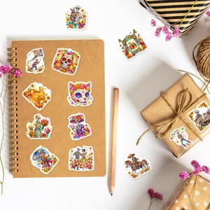 Detailed close-up of colorful Day of the Dead skull stickers arranged on a notebook.