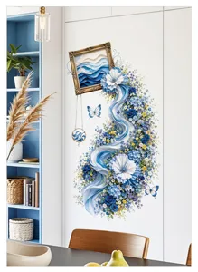 Detail shot of blue rose photo frame floral wall sticker decor in a bright modern bedroom.