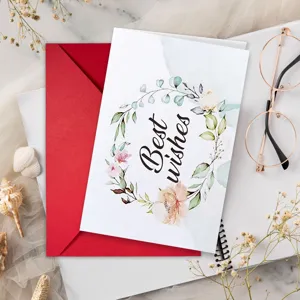 Close-up detail view of a floral watercolor greeting card with envelope for blessings.