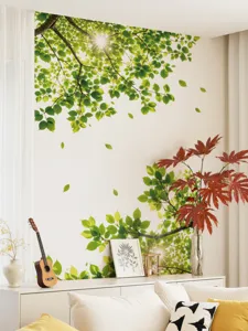 Detailed view of the vibrant green tree leaf wall sticker creating a natural nature vibe indoors.