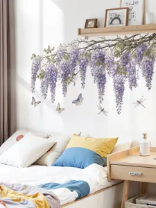 Detailed view of wisteria flower wall sticker decoration applied above a bedroom headboard.