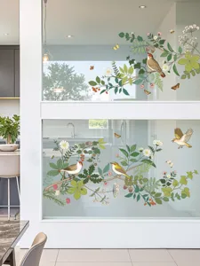 Gedetailleerd uitzicht van plant en vogel glas decoratieve raamstickers voor binnen.