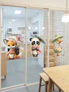 Vista detallada de adorables pegatinas de panda, zorro y pato para ventanas de vidrio.