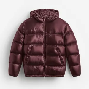 Detailed macro shot showing the glossy texture of a burgundy hooded puffer jacket for men