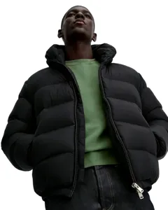 Close-up of a men's winter hooded puffer jacket in black, stylish low angle shot.