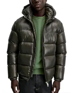 Close-up detail of men's shiny winter puffer jacket with hood in olive green color