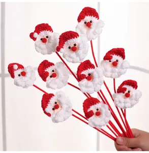 Detail view showing a handmade crochet Santa Claus flower bouquet for Christmas decoration