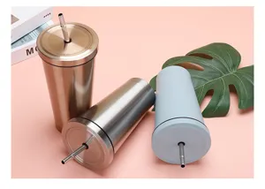 Three stainless steel vacuum tumblers with straws in various metallic and matte finishes