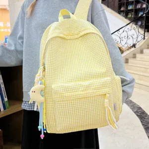 Fashionable yellow and white gingham backpack for women featuring a cute moon plush charm
