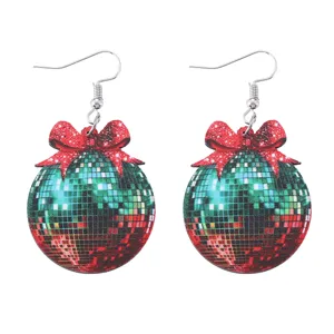 Christmas wooden disco ball earrings featuring a festive red bow, lightweight detail shot.
