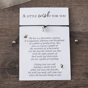 Charming bee wish bracelet with cute card packaging, adjustable black braided cord and silver charm.