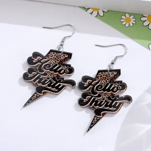 Leopard print lightning acrylic dangle earrings detailed shot showing unique birthday jewelry.