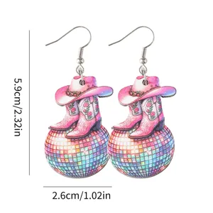Wooden disco ball cowboy hat boots earrings detail, festival style jewelry pendant close-up.