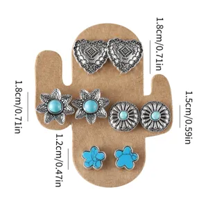 Western cowboy style stud earrings set featuring turquoise and floral designs on display card.